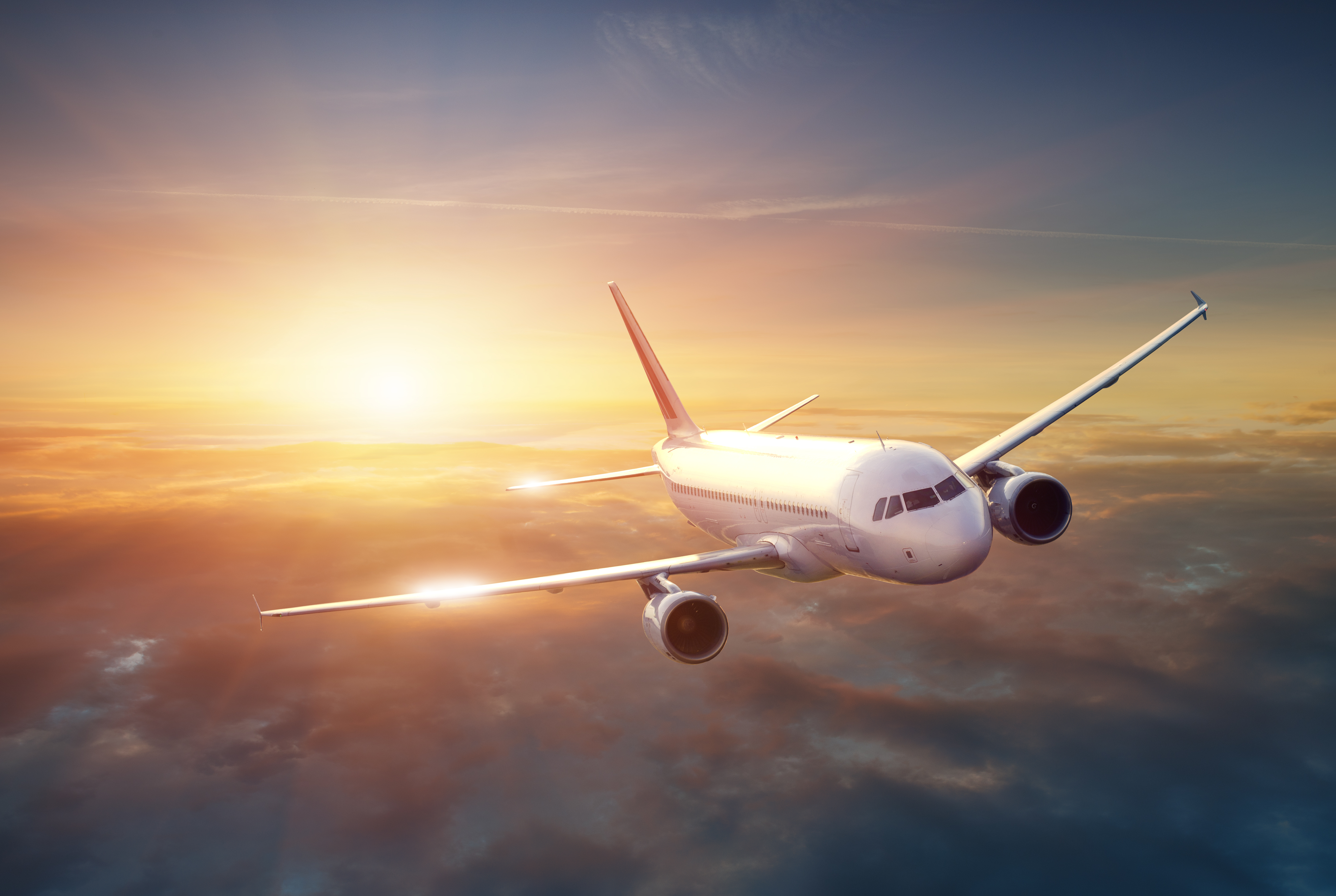 Airplane,In,The,Sky,At,Sunset content-image